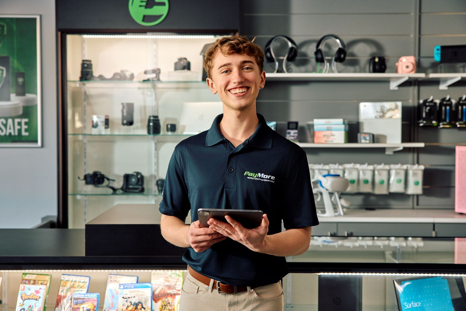 employee holding a tablet and smiling